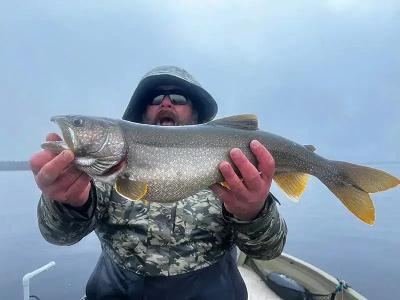 Fisherman-with-Fish-Sebago-Region-17